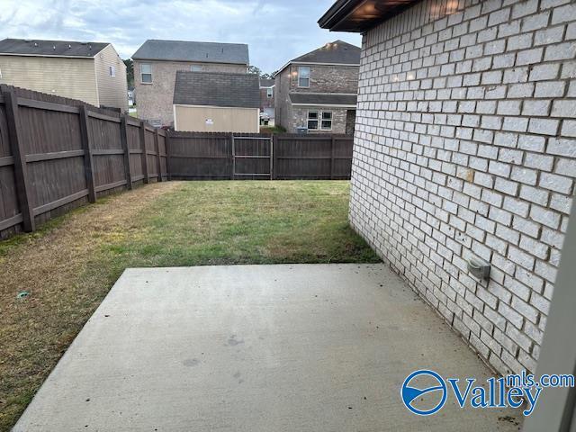 134 Winstead Cir, Owens Cross Roads, AL 35763 - view of yard featuring a fenced backyard and a patio area