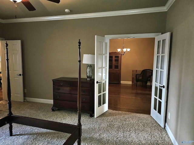 2031 Blake Bottom Rd Unit 2, Huntsville, AL 35806 - carpeted bedroom featuring french doors, crown molding, and a chandelier