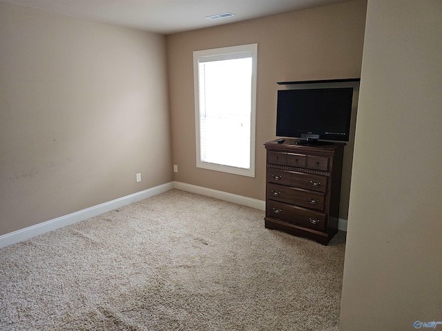 2031 Blake Bottom Rd Unit 2, Huntsville, AL 35806 - unfurnished bedroom with baseboards and light colored carpet