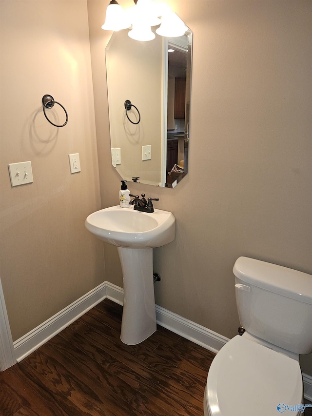 2031 Blake Bottom Rd Unit 2, Huntsville, AL 35806 - half bathroom with baseboards and wood finished floors
