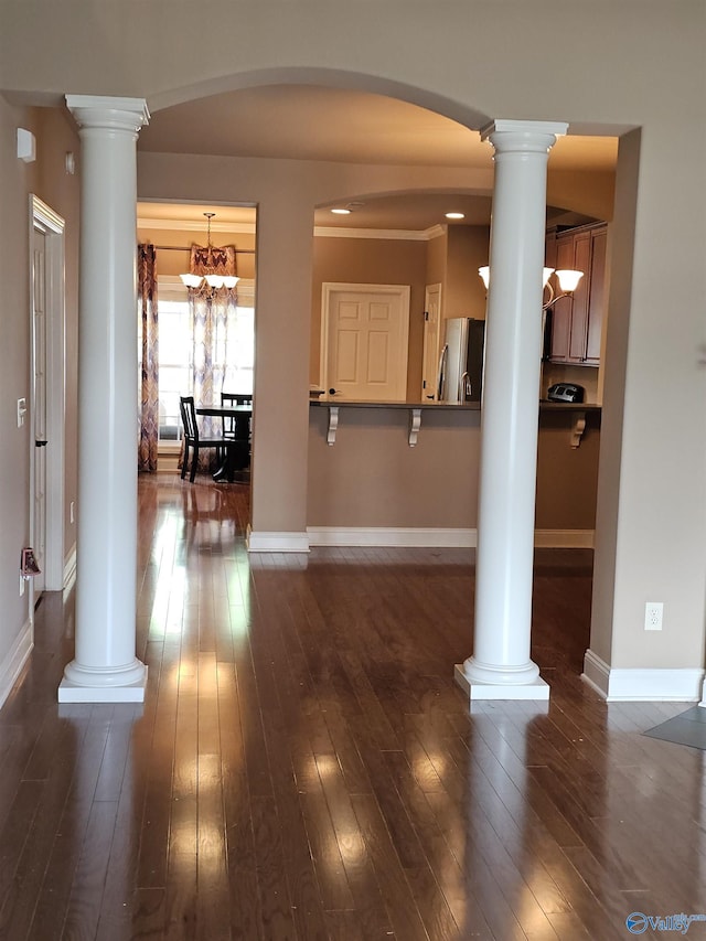 2031 Blake Bottom Rd Unit 2, Huntsville, AL 35806 - foyer entrance featuring ornate columns, dark wood-style flooring, a chandelier, and arched walkways