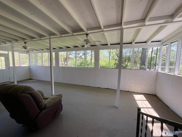 sunroom / solarium with a ceiling fan