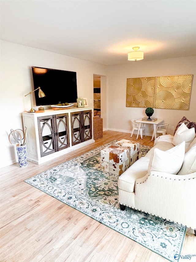 659 Vaughn Bridge Rd NW, Hartselle, AL 35640 - living area with wood finished floors and baseboards