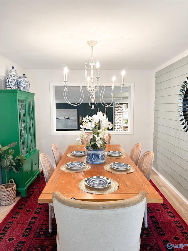 659 Vaughn Bridge Rd NW, Hartselle, AL 35640 - dining room with dark wood-style floors, a chandelier, and baseboards
