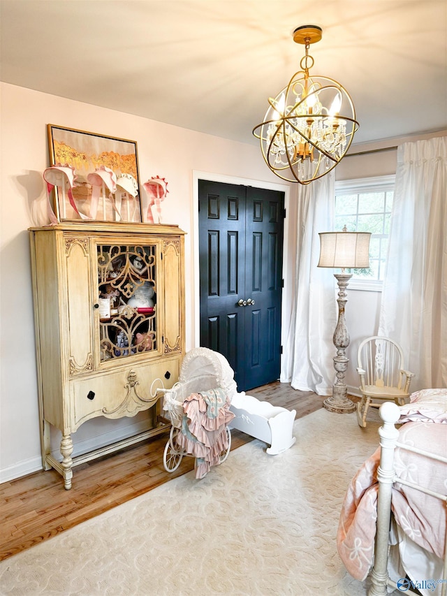 659 Vaughn Bridge Rd NW, Hartselle, AL 35640 - living area with wood finished floors, a chandelier, and baseboards