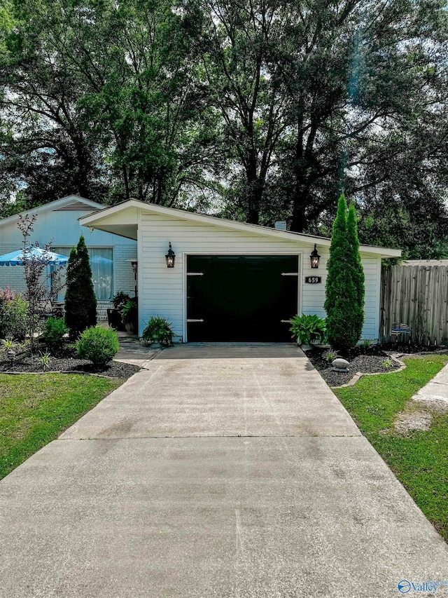 659 Vaughn Bridge Rd NW, Hartselle, AL 35640 - view of front of house with driveway and a garage