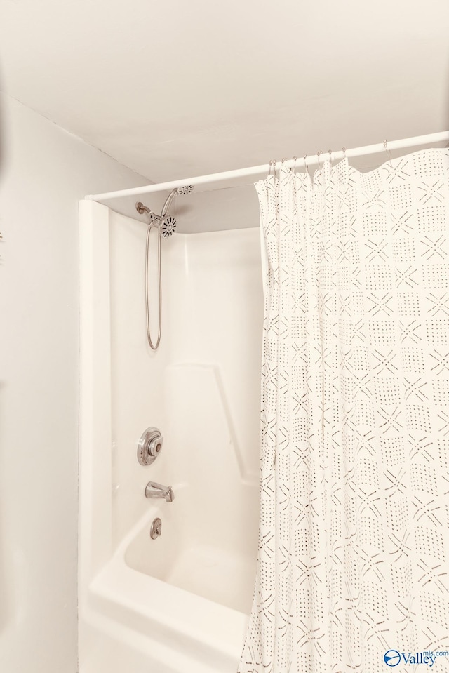 full bathroom with shower / bath combo