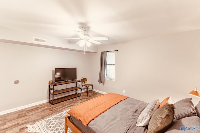 bedroom featuring light wood-type flooring and ceiling fan