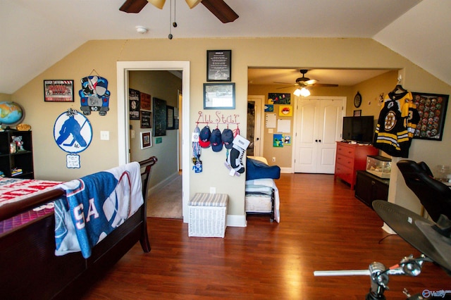 bedroom with ceiling fan, dark wood-type flooring, and lofted ceiling