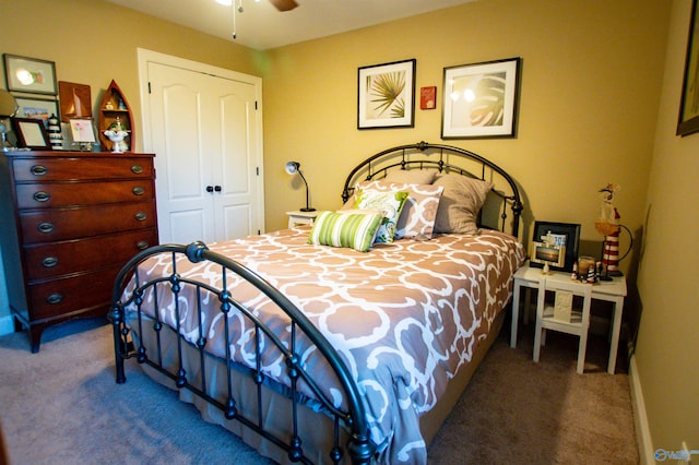 bedroom featuring carpet, ceiling fan, and a closet