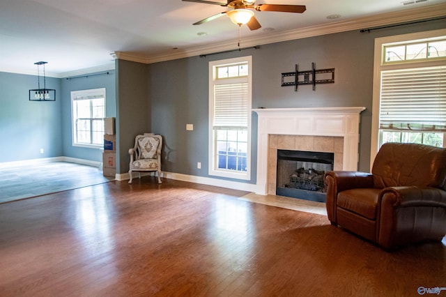 29960 Copper Run Dr, Harvest, AL 35749 - living room with a ceiling fan, wood finished floors, ornamental molding, and a fireplace