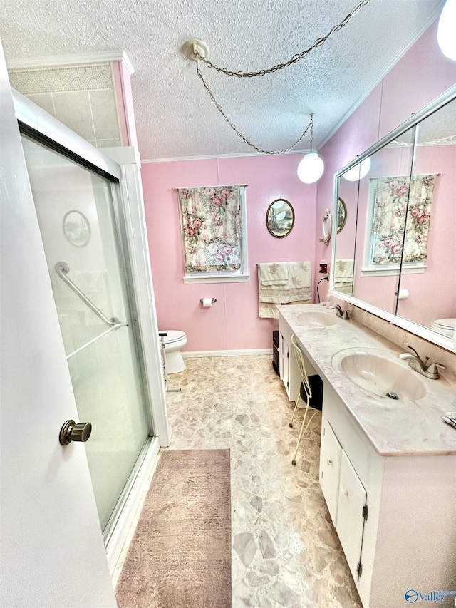 bathroom featuring vanity, an enclosed shower, a textured ceiling, and toilet