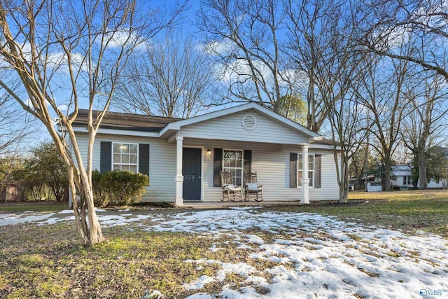 ranch-style house featuring covered porch