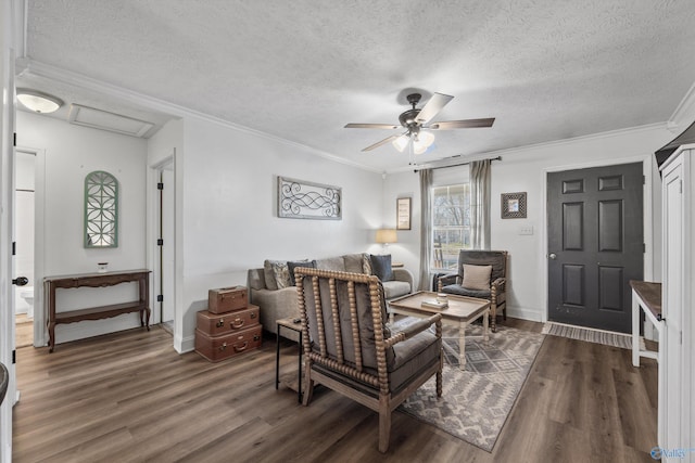 living room with a textured ceiling, ceiling fan, crown molding, and dark hardwood / wood-style floors