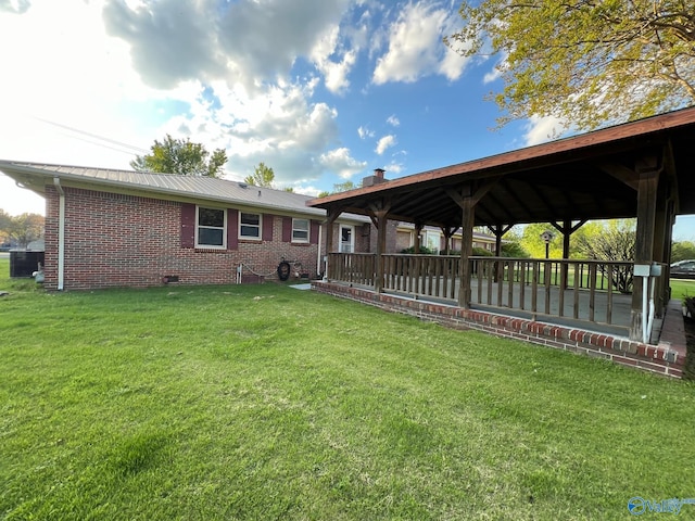 back of house with a yard