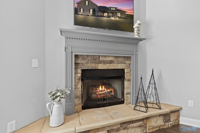 details with a stone fireplace