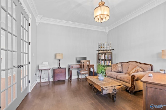 living room with dark wood-type flooring, crown molding, french doors, and a chandelier