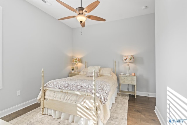 bedroom with ceiling fan and wood-type flooring