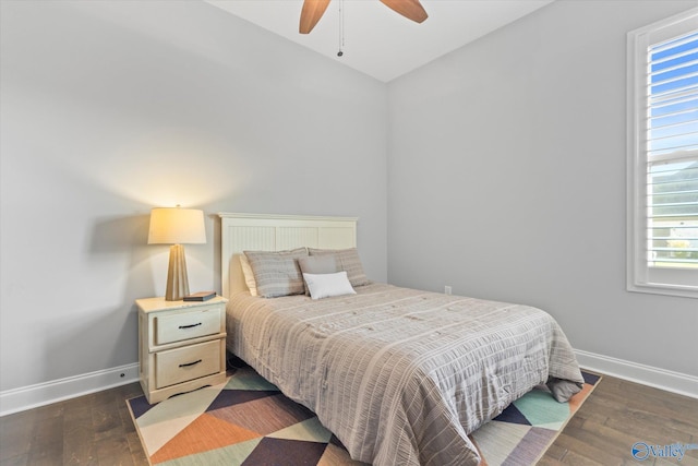 bedroom featuring dark hardwood / wood-style flooring and ceiling fan