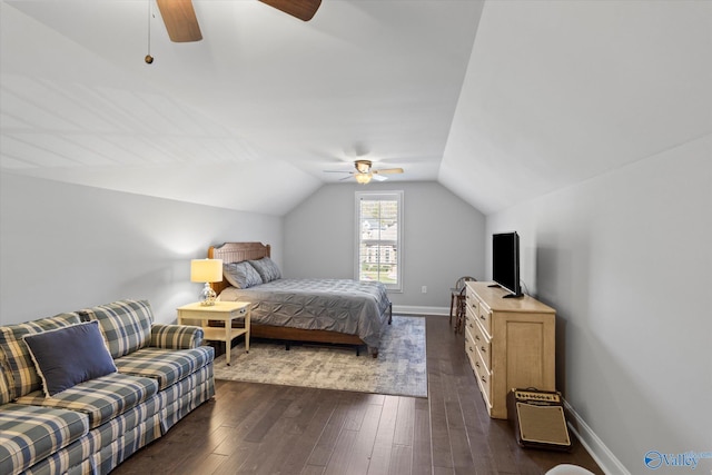 bedroom with dark hardwood / wood-style floors, vaulted ceiling, and ceiling fan