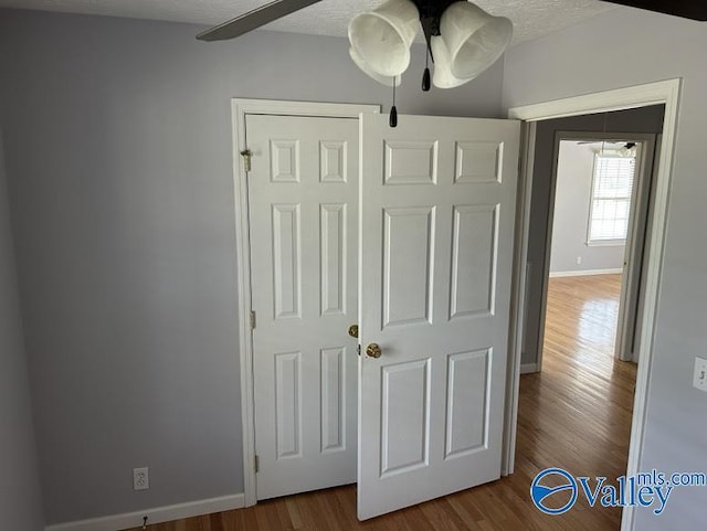 interior details featuring hardwood / wood-style flooring and a textured ceiling