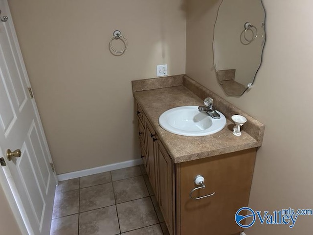 bathroom with vanity and tile patterned floors