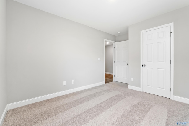 unfurnished bedroom with carpet floors