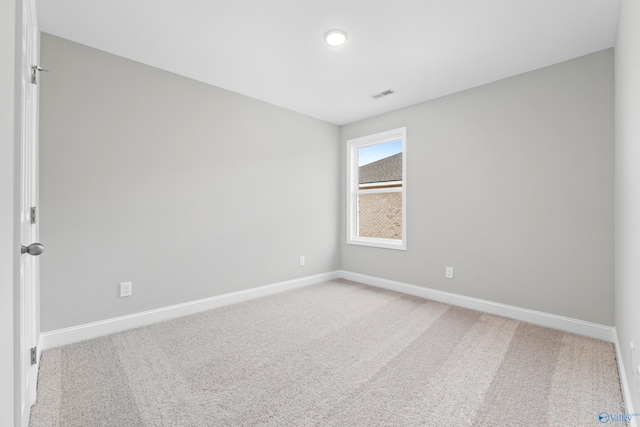 spare room featuring carpet floors