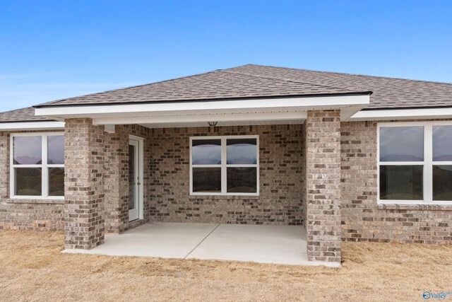 back of property with a patio area