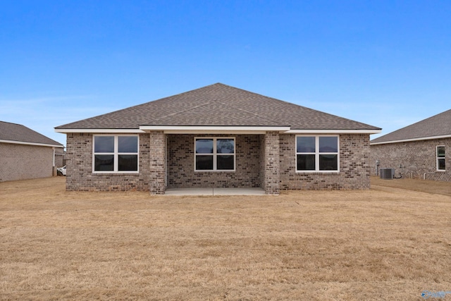 back of property with cooling unit and a patio area