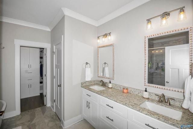 bathroom with vanity, crown molding, and a shower with shower door