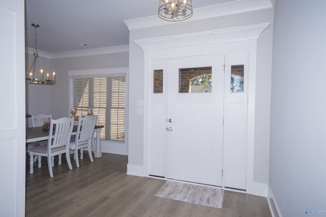 entrance foyer with a wealth of natural light, crown molding, and hardwood / wood-style flooring