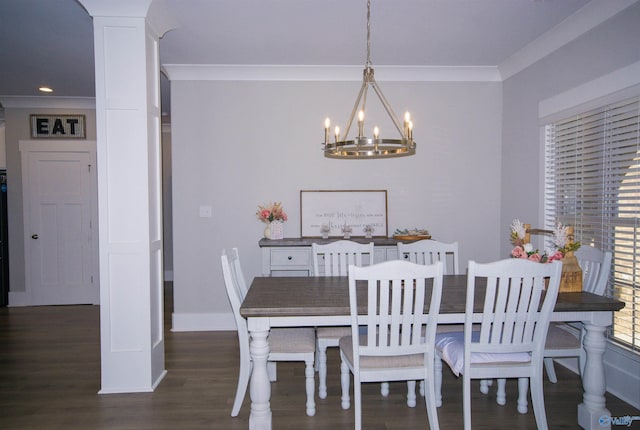 dining room with ornamental molding, decorative columns, dark hardwood / wood-style floors, and an inviting chandelier