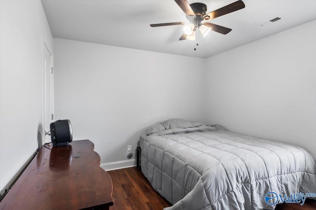 bedroom featuring dark hardwood / wood-style flooring and ceiling fan