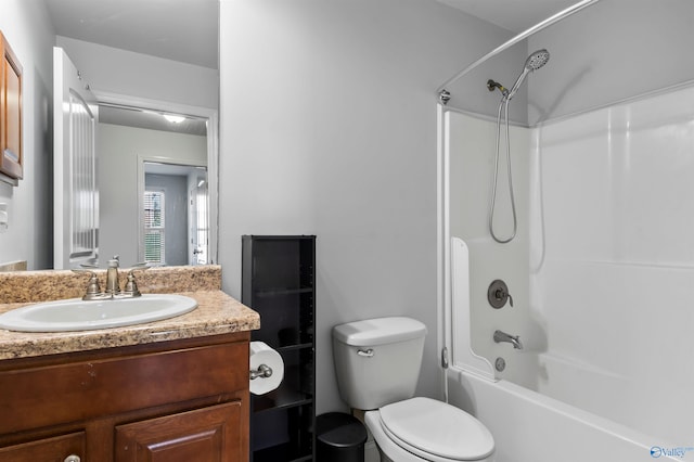 full bathroom featuring toilet, shower / bathing tub combination, and vanity