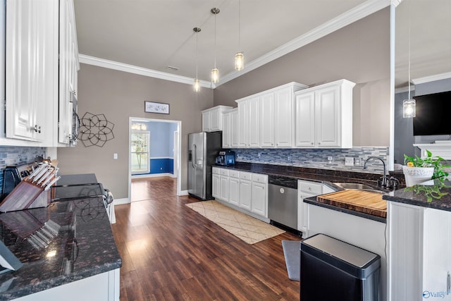 kitchen featuring a sink, appliances with stainless steel finishes, crown molding, and white cabinetry