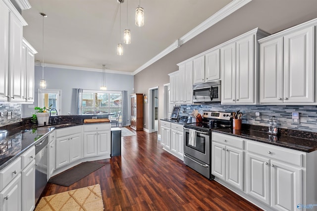 kitchen with white cabinets, stainless steel appliances, and a sink