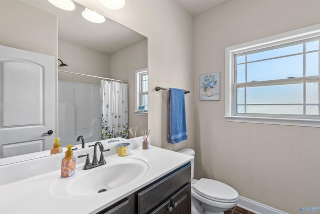 full bath featuring curtained shower, baseboards, toilet, and vanity