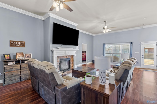 living room with a stone fireplace, dark wood-type flooring, and a ceiling fan