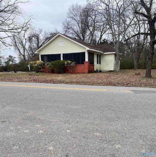 view of front of property with a sunroom