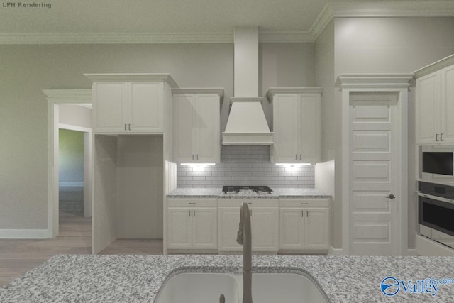 HUNTINGTONB Newby Chapel Rd, Athens, AL 35613 - kitchen featuring oven, ornamental molding, gas cooktop, a sink, and tasteful backsplash