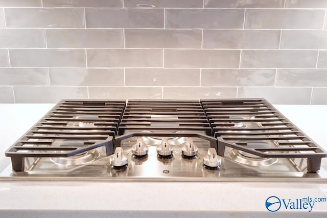 HUNTINGTONB Newby Chapel Rd, Athens, AL 35613 - kitchen view of decorative backsplash and stainless steel gas cooktop