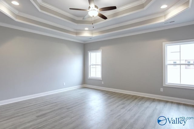 HUNTINGTONB Newby Chapel Rd, Athens, AL 35613 - empty room featuring a tray ceiling, crown molding, wood finished floors, ceiling fan, and baseboards