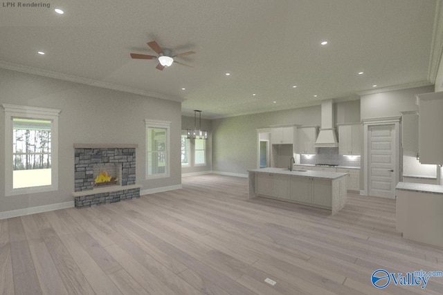 HUNTINGTONB Newby Chapel Rd, Athens, AL 35613 - kitchen featuring white cabinets, a sink, open floor plan, crown molding, and ceiling fan