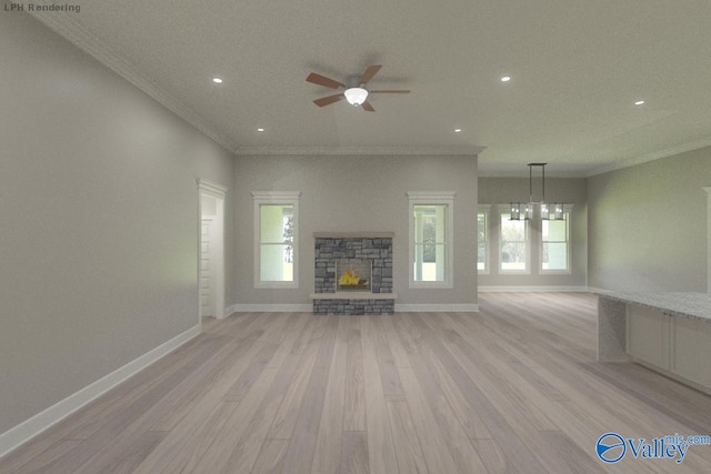HUNTINGTONB Newby Chapel Rd, Athens, AL 35613 - unfurnished living room featuring light wood-type flooring, crown molding, a stone fireplace, healthy amount of natural light, and a ceiling fan