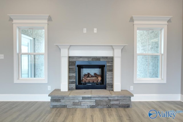 HUNTINGTONB Newby Chapel Rd, Athens, AL 35613 - detailed view of wood finished floors, baseboards, and a fireplace