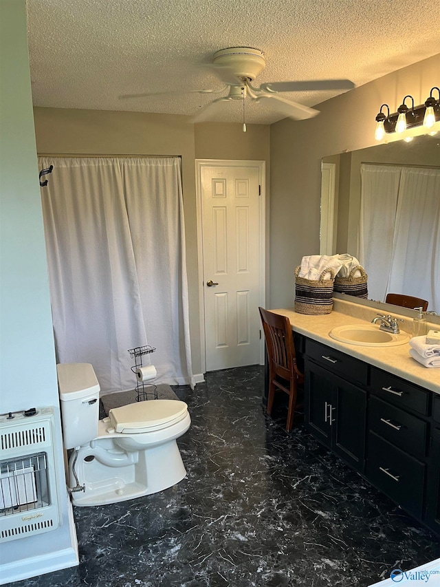 bathroom featuring a textured ceiling, toilet, ceiling fan, tile patterned flooring, and vanity