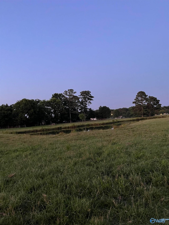 mountain view featuring a rural view