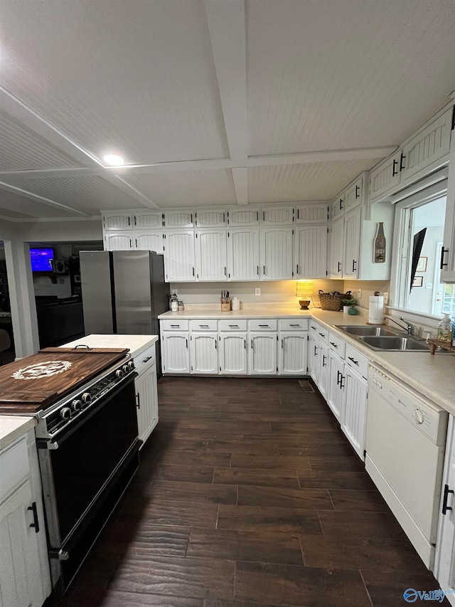 kitchen featuring dark hardwood / wood-style flooring, black range oven, dishwasher, white cabinetry, and sink