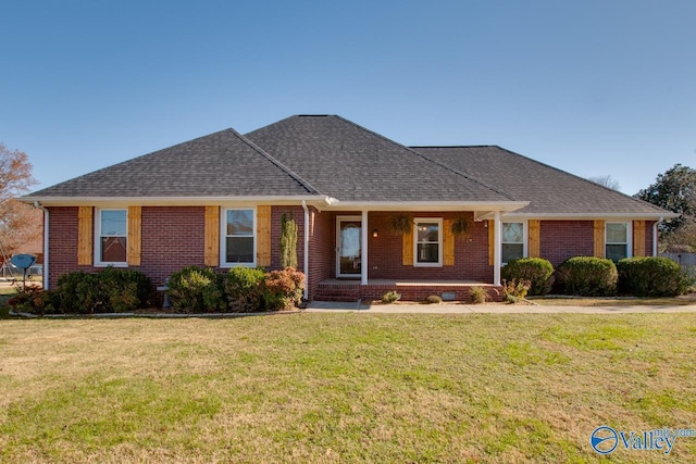 single story home featuring a front yard and covered porch